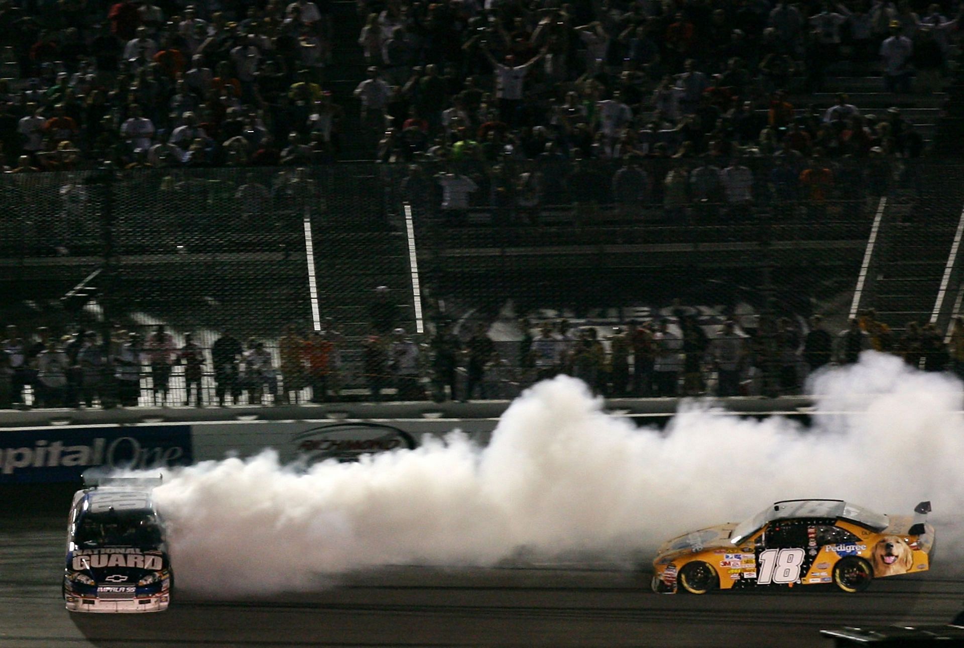 Dale Earnhardt Jr. (88) spins after colliding with Kyle Busch (18 ) during the 2008 NASCAR Sprint Cup Series race at Richmond International Raceway. Source: Getty